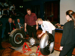 Children trying a car's back axle out